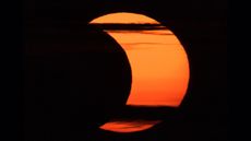 A partial solar eclipse is seen from Arlington, Virginia, Thursday, June 10, 2021.
