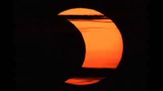 A partial solar eclipse is seen from Arlington, Virginia, Thursday, June 10, 2021.