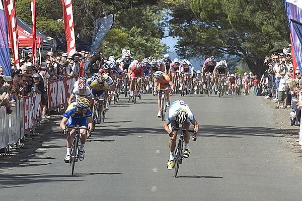 Chris Sutton (left) of Skilled/Lowe Farms looks around to see Mazda's Greg Henderson surge ahead to win the second race in Geelong.