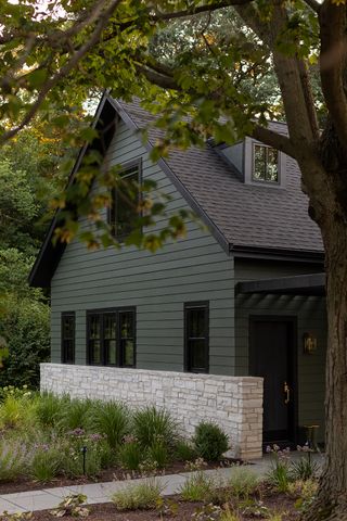 exterior of a house painted dark green
