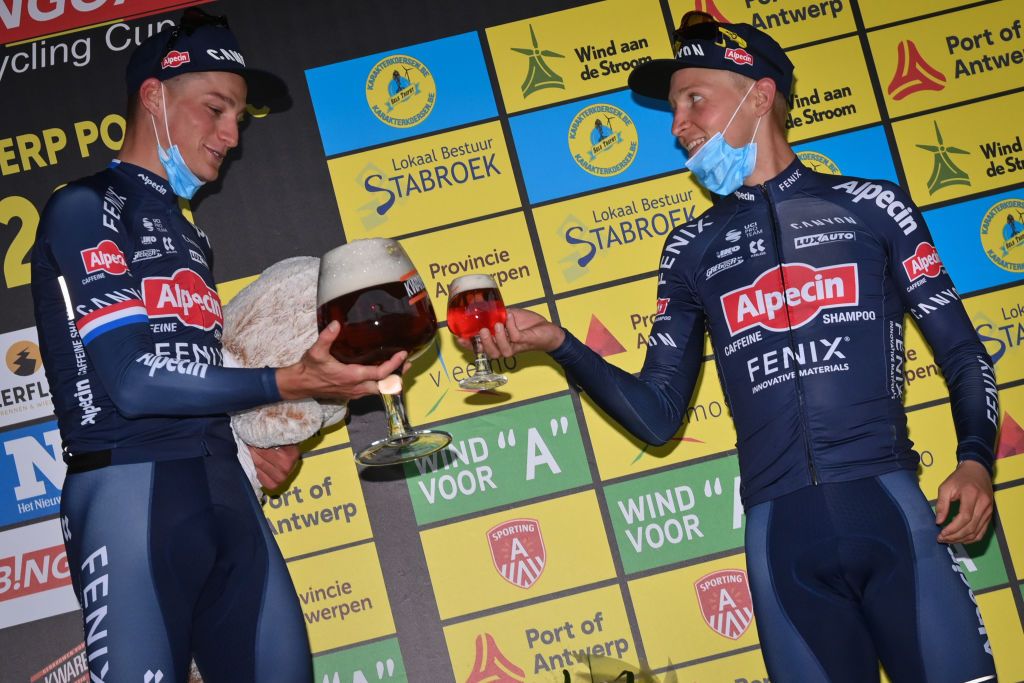 Dutch Mathieu van der Poel of AlpecinFenix and Belgian Tim Merlier of AlpecinFenix pictured on the podium after the Antwerp Port Epic cycling race 183km in and around Antwerp Sunday 12 September 2021 BELGA PHOTO DAVID STOCKMAN Photo by DAVID STOCKMANBELGA MAGAFP via Getty Images