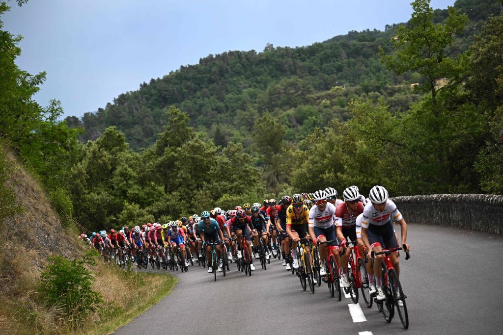 The pack rides the last climb during the first stage of the 74th edition of the Criterium du Dauphine cycling race 192 km between La VoultesurRhone and Beauchastel on June 5 2022 Photo by Marco BERTORELLO AFP Photo by MARCO BERTORELLOAFP via Getty Images