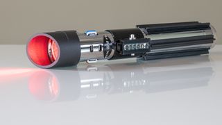 The SabersPro Vader lightsaber, ignited without the blade installed.