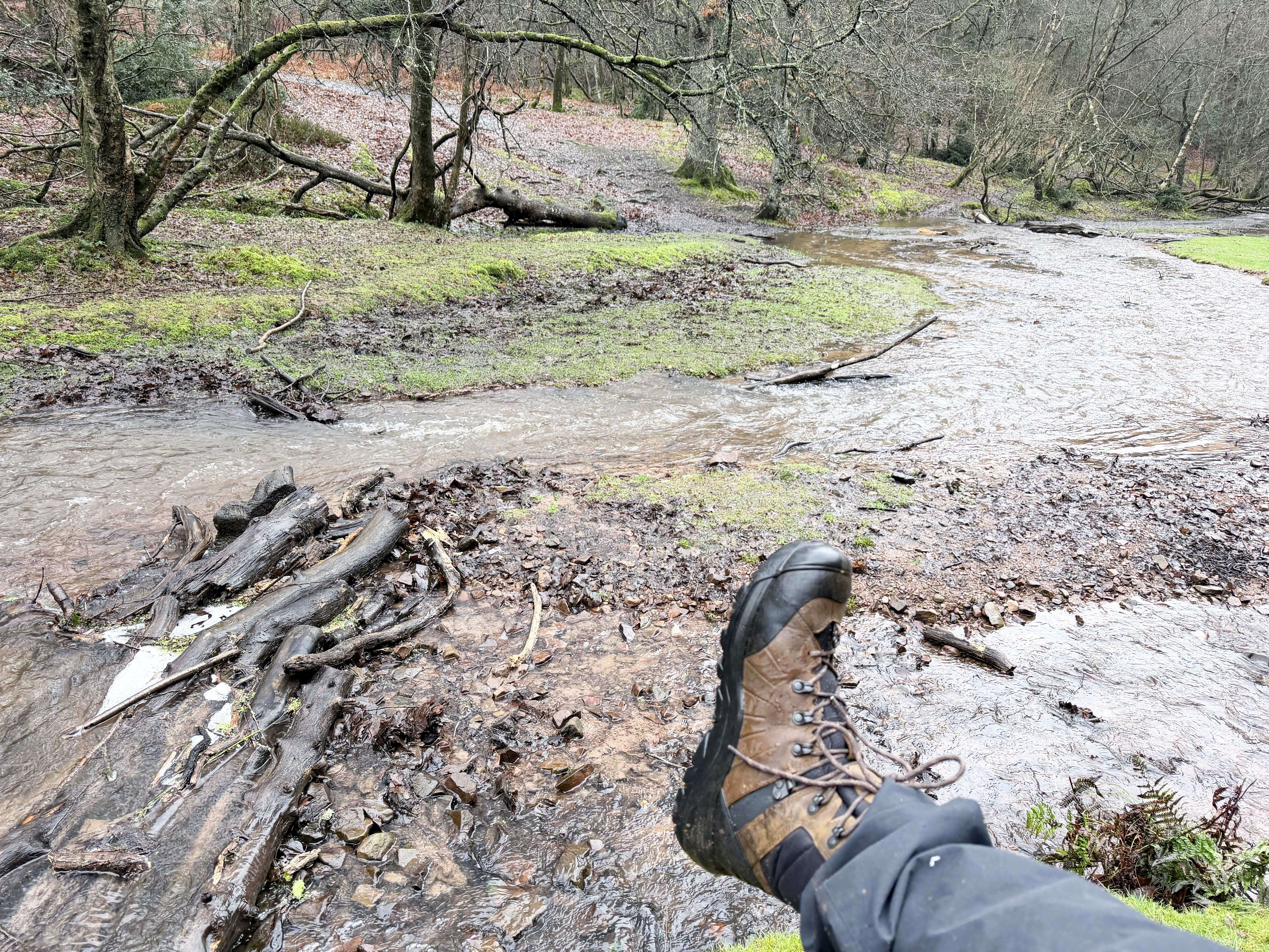 The Keen Revel IV on foot being held up in the air with a river in the background