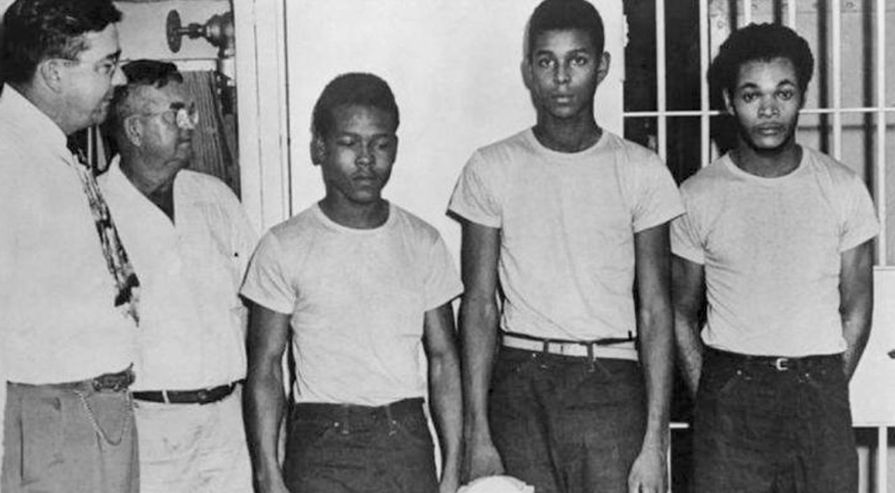 Lake County Sheriff Willis McCall, far left, and an unidentified man stand next to Walter Irvin, Samuel Shepherd, and Charles Greenlee in Florida.