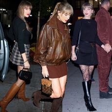 Taylor Swift wearing knee-high boots for winter with mini skirts