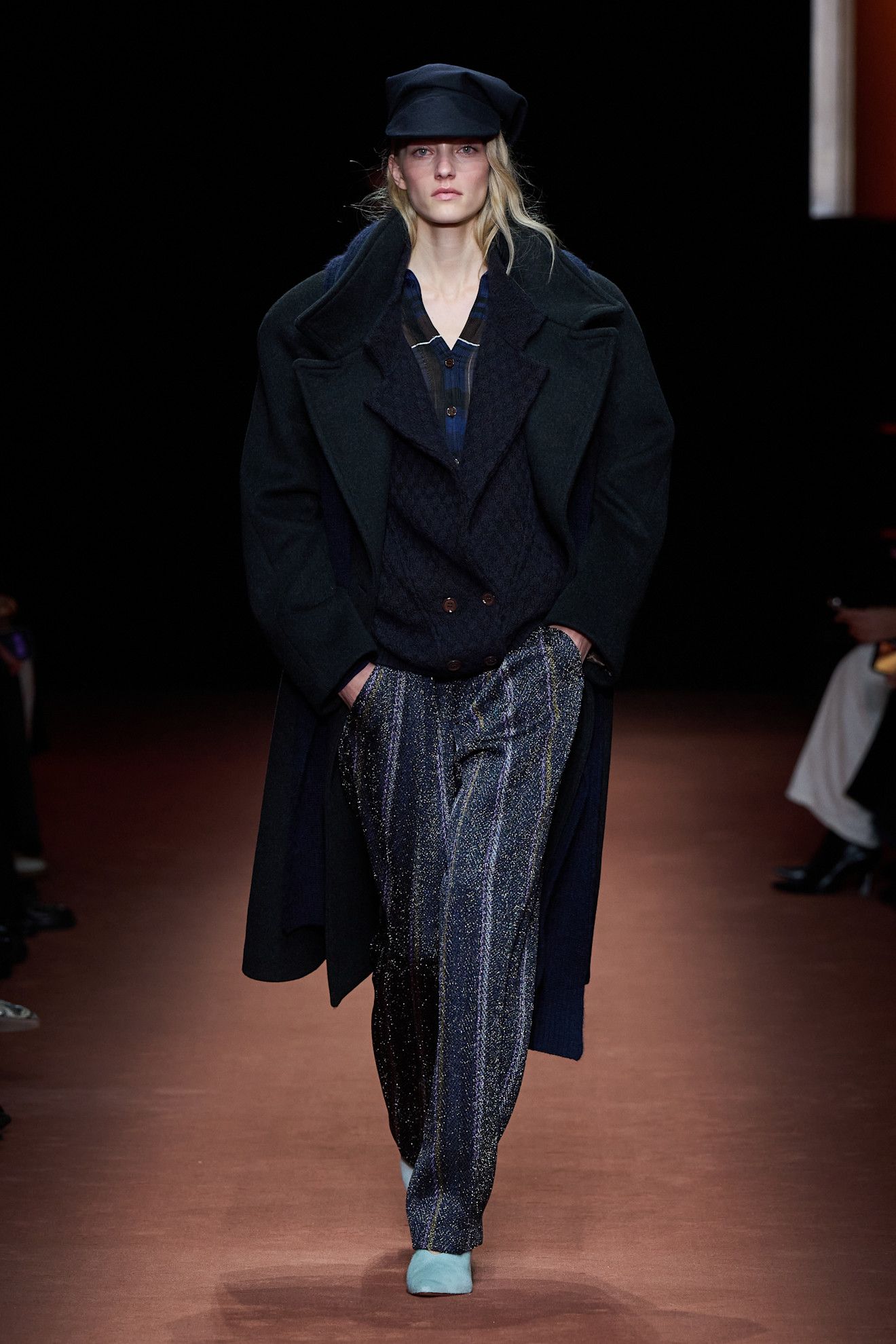 A model at the Missoni show wearing blue shoes.