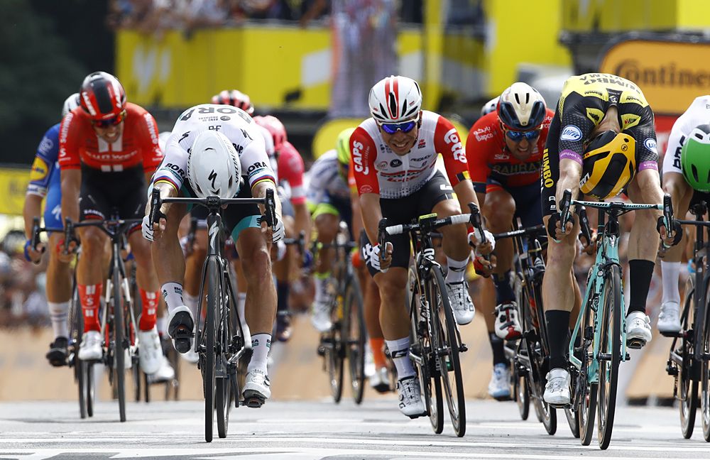 Mike Teunissen (Jumbo-Visma) beats Peter Sagan (Bora-Hansgrohe) and Caleb Ewan (Lotto Soudal) to win the opening stage at the Tour de France in Brussels