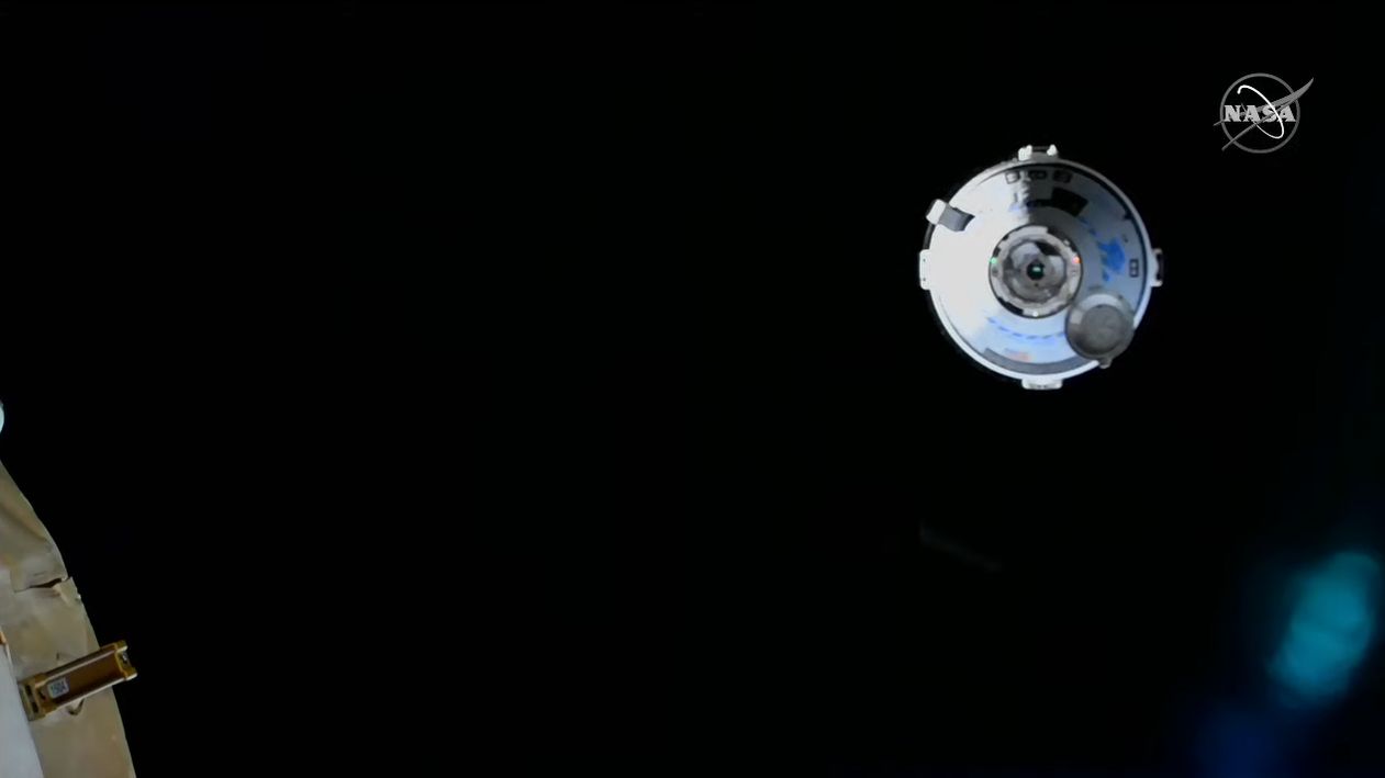 Boeing's Starliner OFT-2 spacecraft approaches the International Space Station during its first-ever docking operations on May 20, 2022.