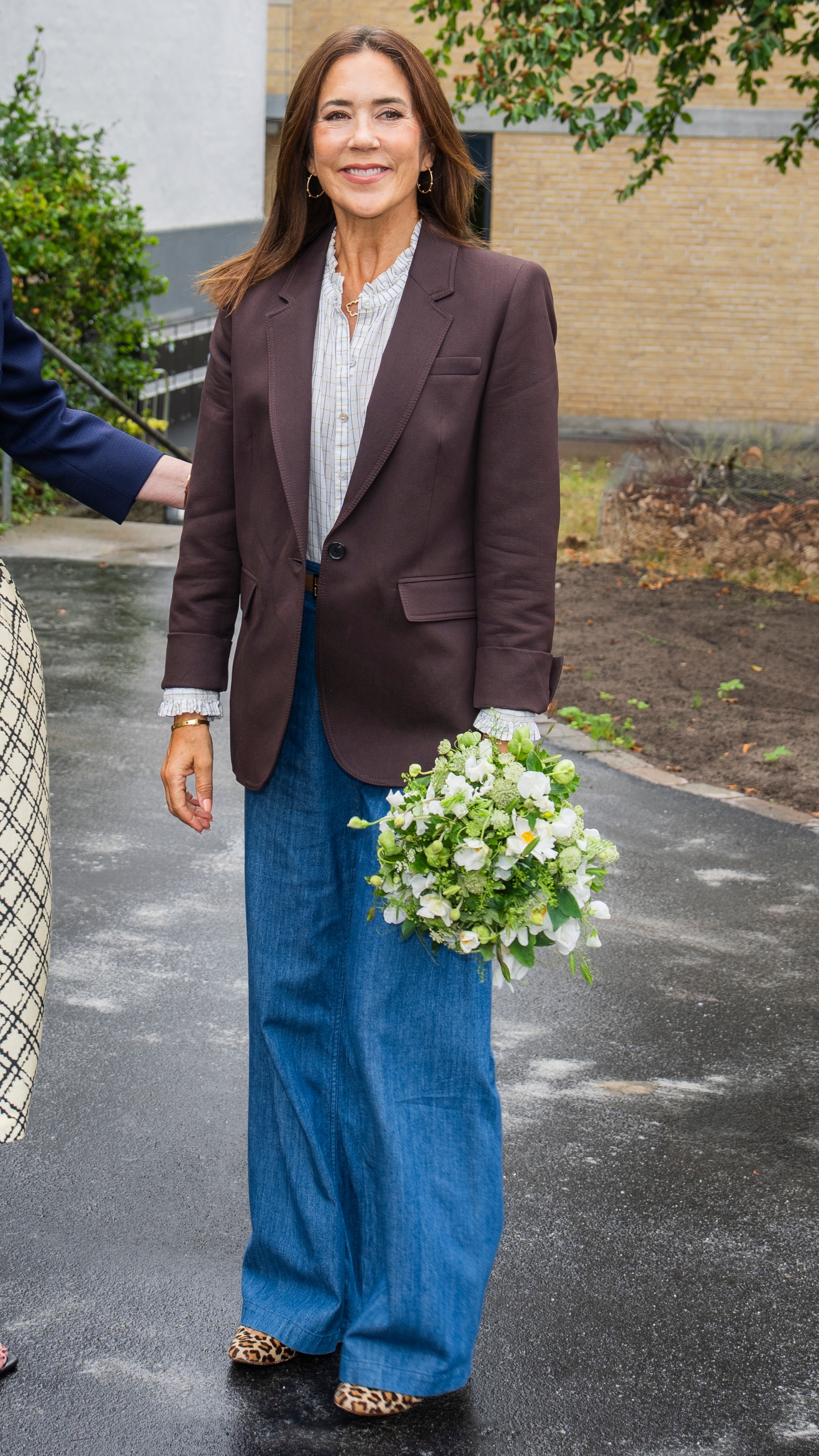 Queen Mary of Denmark arrives for her visit to The Deaconess Foundation - Momentet and is welcomed by one of the residents of Momentet on August 19, 2026