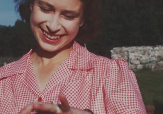 A beaming Princess Elizabeth shows off her new engagement ring soon after Prince Philip’s marriage proposal at Balmoral in 1946 taken from the upcoming BBC documentary, 'Elizabeth: The Unseen Queen'
