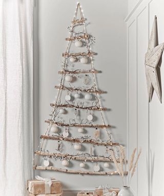Hanging Christmas tree made using birch branches with frosted snow effect