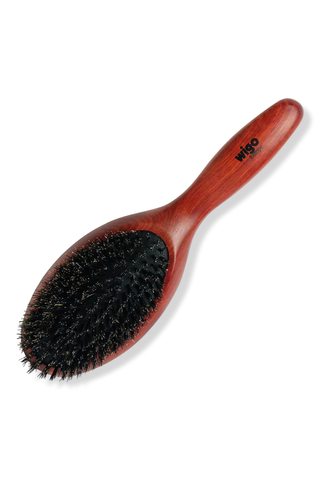 brown round boar bristle brush on a white background