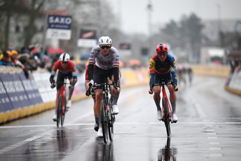 HARELBEKE BELGIUM MARCH 22 Nils Politt of Germany and UAE Team Emirates crosses the finish line during the 67th E3 Saxo Bank Classic Harelbeke 2024 a 2076km one day race from Harelbeke to Harelbeke UCIWT on March 22 2024 in Harelbeke Belgium Photo by Tim de WaeleGetty Images