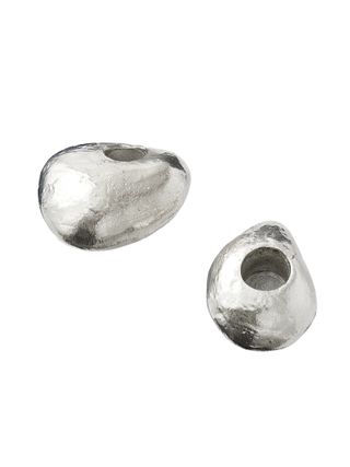 Two egg-shaped silver-plated brass candle holders.