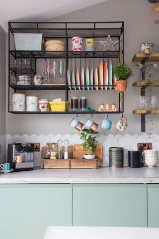 black metal wire open shelving with compartments for plates and cups