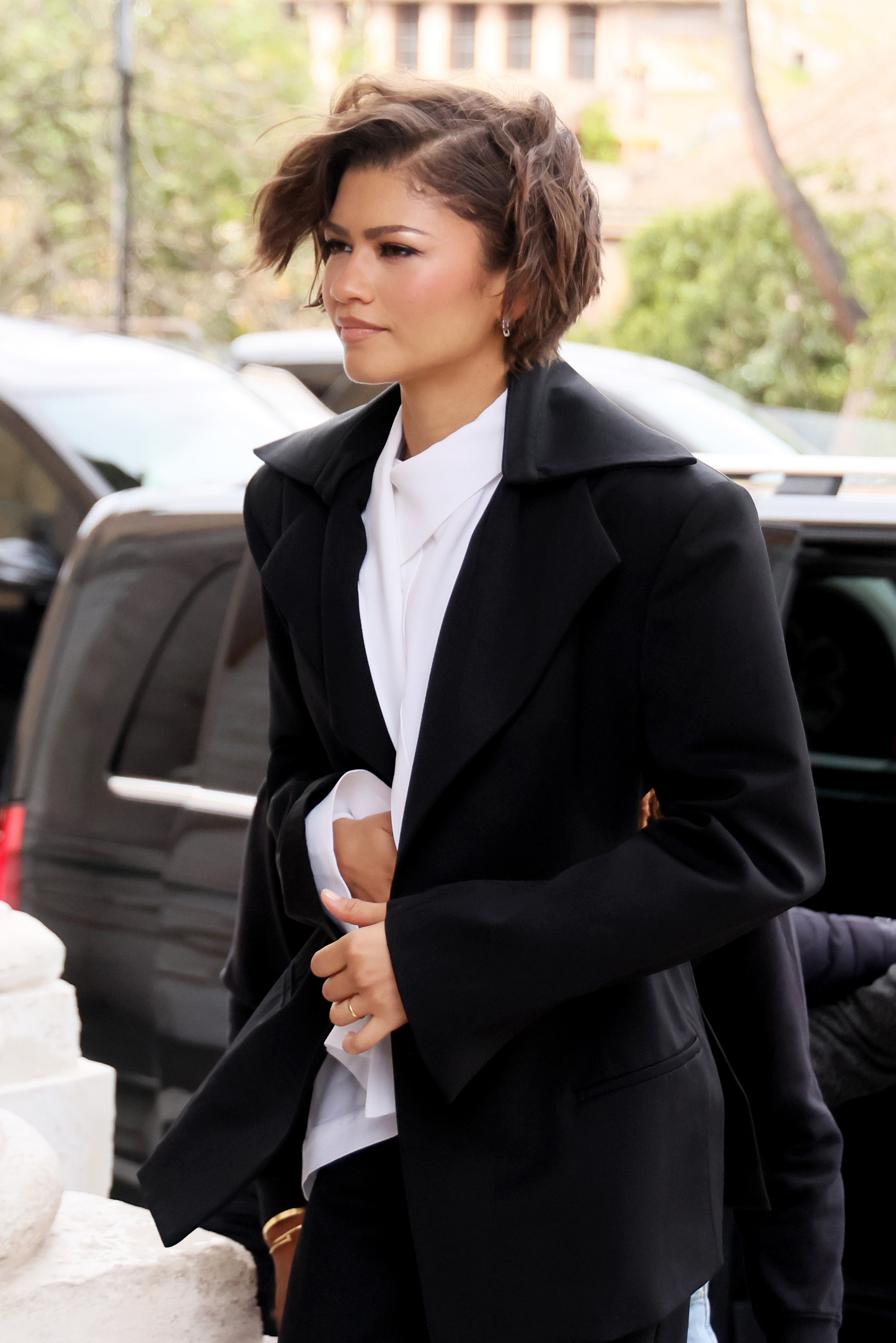 Zendaya was spotted on 'The Drama' press tour wearing a classic black-and-white work suit