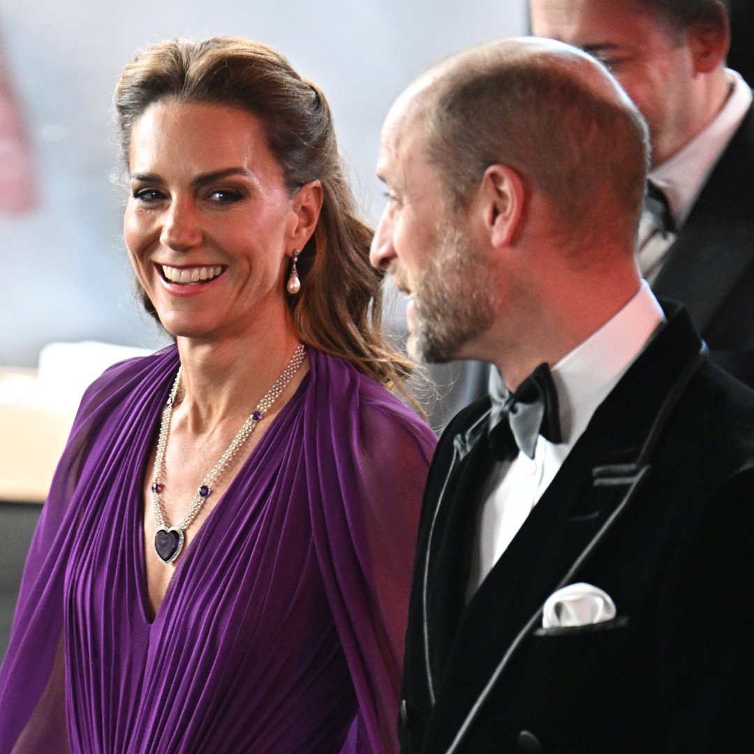 Princess Kate wearing a purple gown with Prince William at the Digger premiere