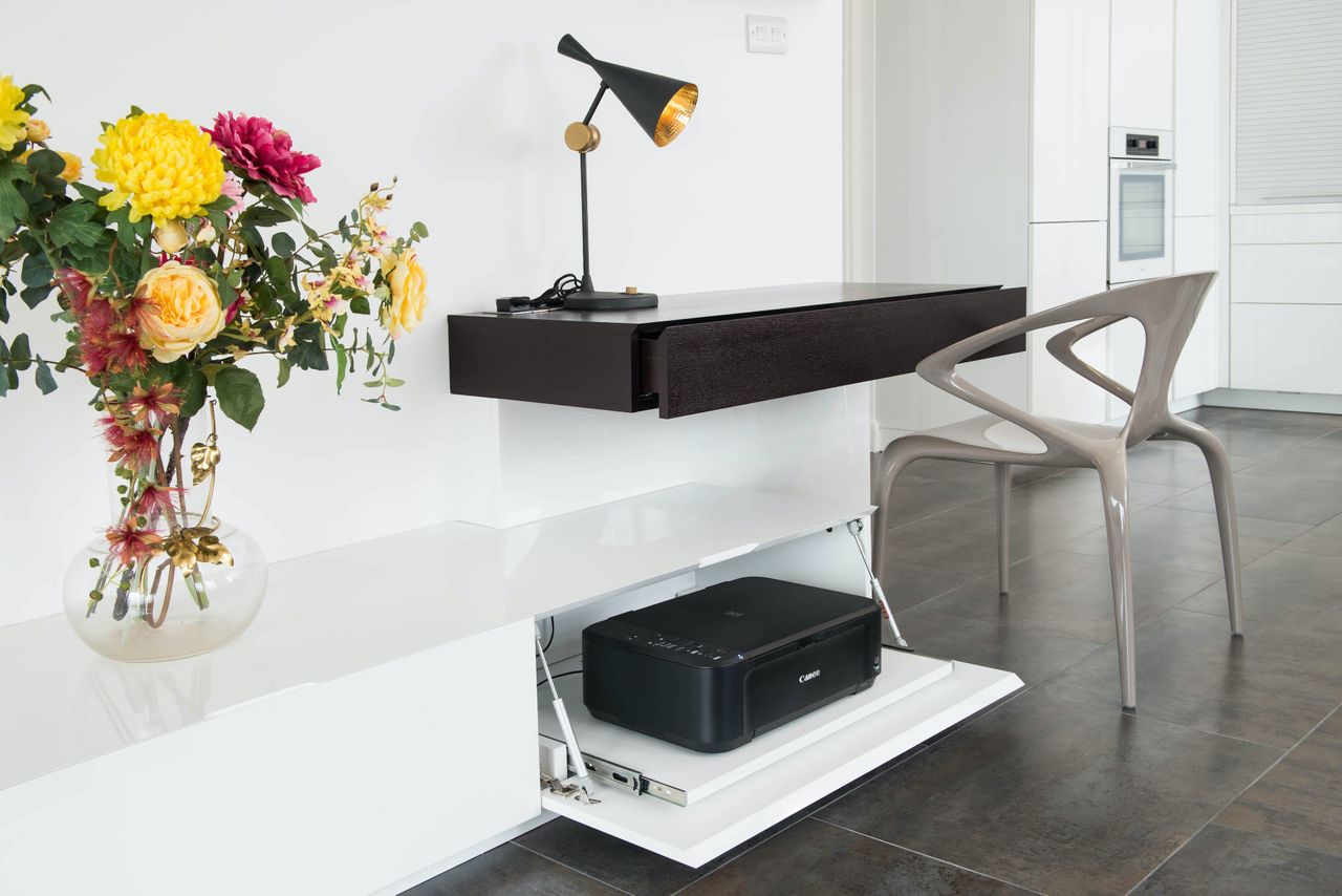 Floating desk with lamp and printer in a pull-out drawer