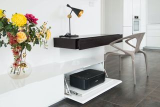 floating desk with lamp and printer in pull out drawer