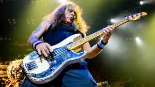 Steve Harris playing bass onstage with Iron Maiden in 2025