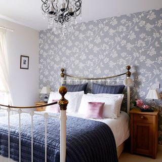 bedroom with wallpaper and white wall