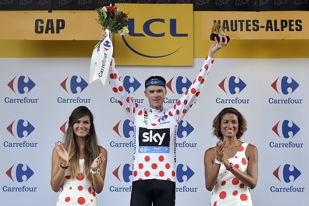 Chris Froome (Tea Sky) stands on the podium as the mountain leader