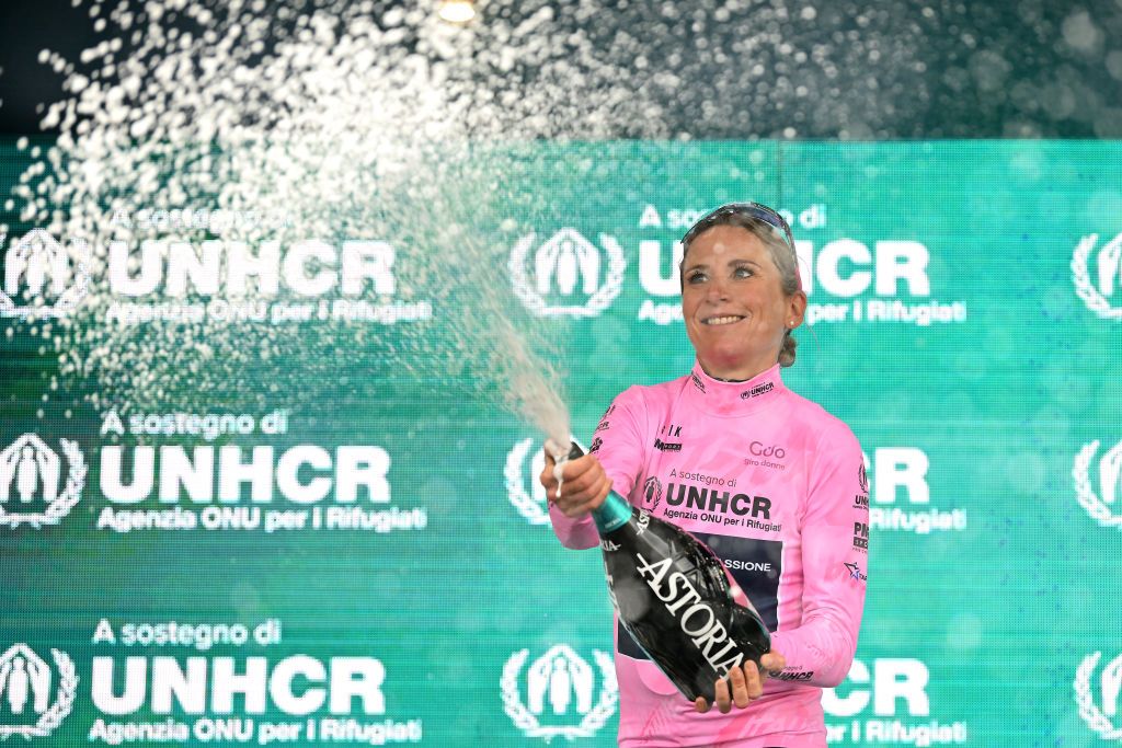 PASSO DEL MANIVA ITALY JULY 07 Annemiek Van Vleuten of Netherlands and Movistar Team celebrates winning the pink leader jersey on the podium ceremony after the 33rd Giro dItalia Donne 2022 Stage 7 a 1129km stage from Prevalle to Passo del Maniva 1743m GiroDonne UCIWWT on July 07 2022 in Passo del Maniva Italy Photo by Dario BelingheriGetty Images