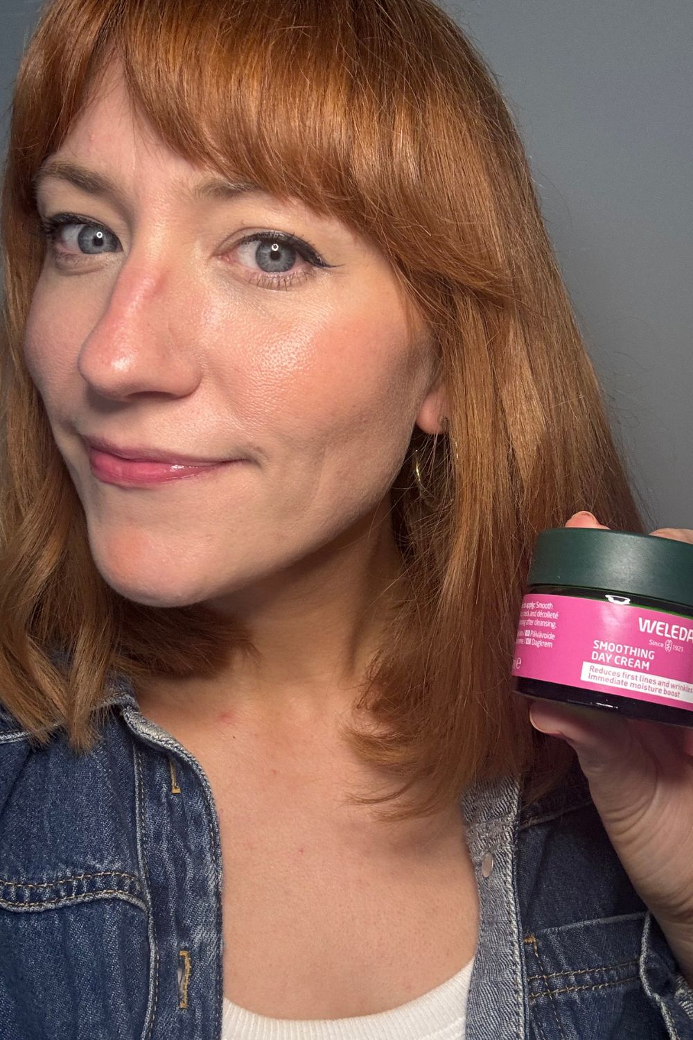 a headshot of matilda with a tub of weleda day cream