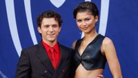 Tom Holland and Zendaya posing at the German fan event for Spider-Man: Brand New Day. 