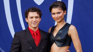 Tom Holland and Zendaya posing at the German fan event for Spider-Man: Brand New Day. 