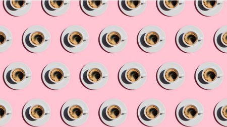 Pattern made of cup of fresh coffee on pastel pink color background. Directly above view of fresh coffee in white cups. 