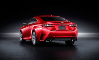Rear view of a red two-door Lexus RC 300h Premier against a black background