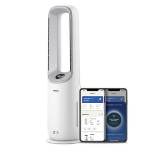 white Philips Air Performer 2-in-1: Purifier & Cooling Fan with a smartphone next to it