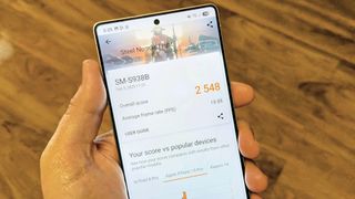 Samsung Galaxy S25 Ultra in-hand showing its 3DMark benchmark result