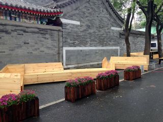 a series of outdoor wooden seating