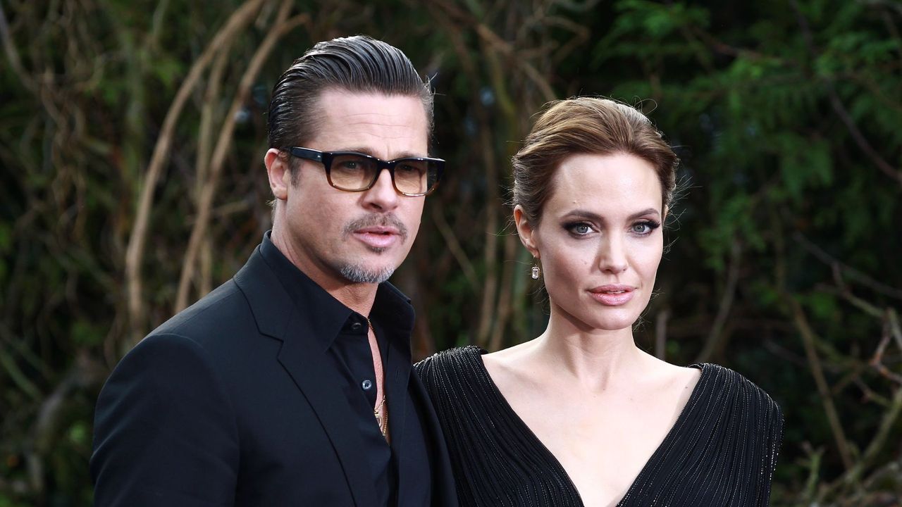 Angelina Jolie and Brad Pitt attend a private reception for costumes and props from Disney&#039;s &quot;Maleficent&quot;