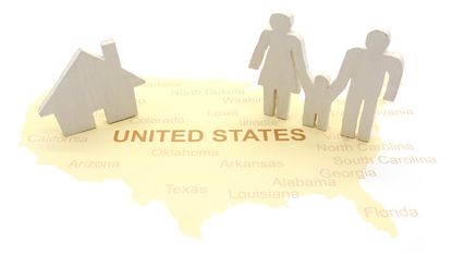 cut-out family and house on a map of the United States