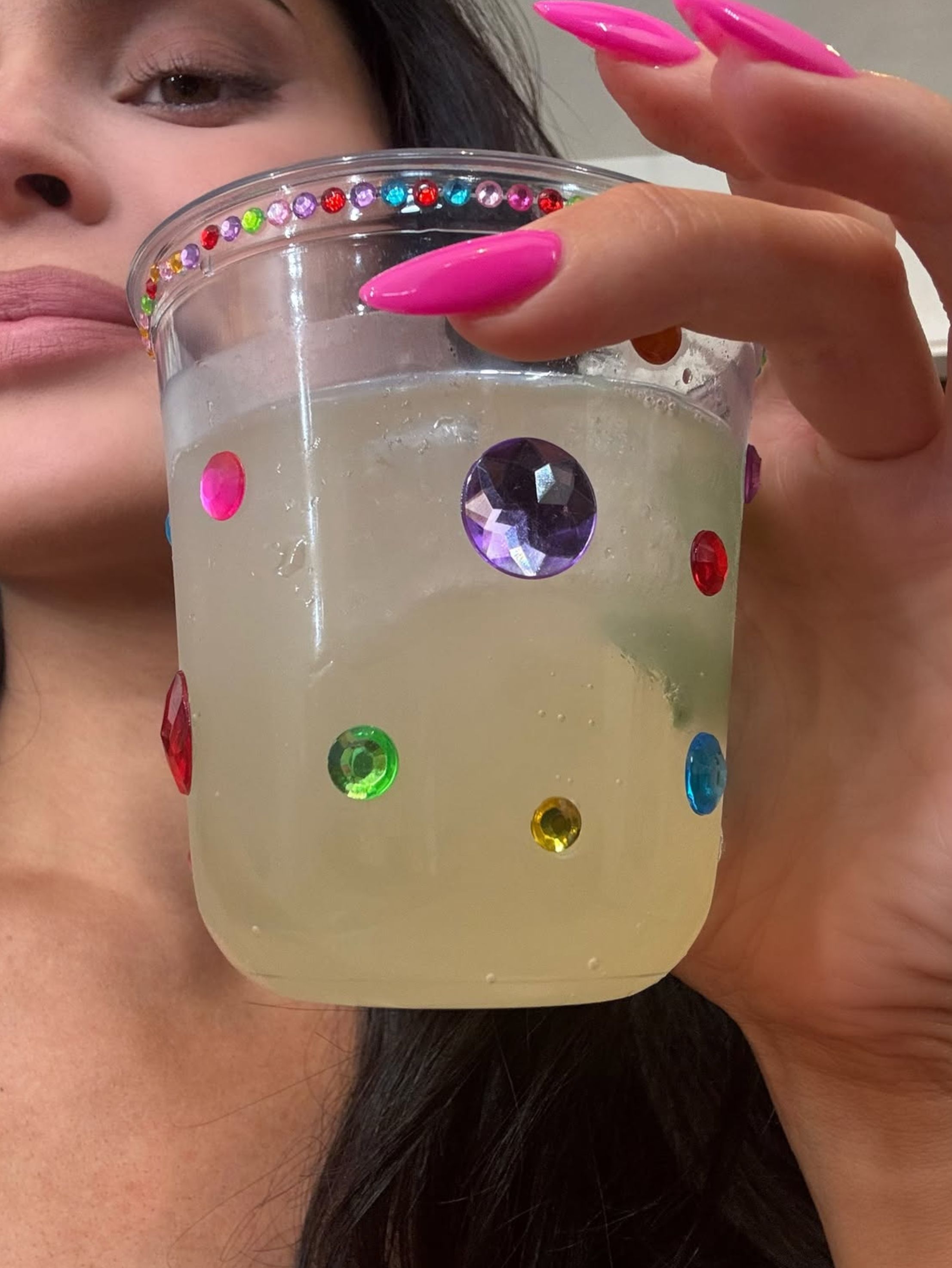 kylie jenner's jewel encrusted birthday cup with drink in