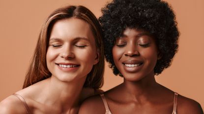 best eye cream - close up of a black model and a white model with their eyes closed - gettyimages1301823846 