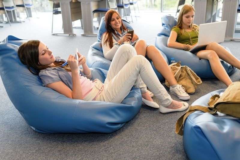 Teen girls at the library online.