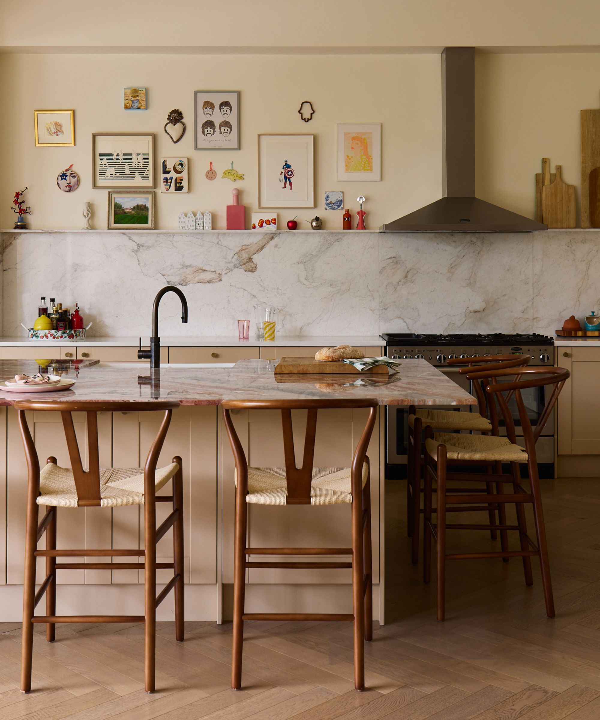 A kitchen with clay colored cabinets and warm white walls