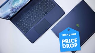 Alienware 16 Aurora gaming laptops with one closed and one open on surface with tom's guide price drop badge