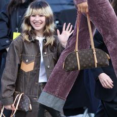 Celebrities attended the Louis Vuitton Fall 2026 show with monogram bags to celebrate the print's 130th anniversary