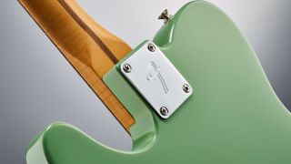 The neck plate of a Fender Player II Telecaster