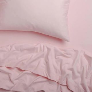 A pink sheet bedding set