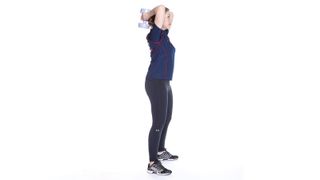 Woman doing a double arm triceps extension as part of a dumbbell arms workout