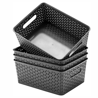 A set of four stackable storage baskets.