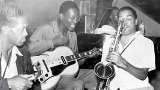 Photograph of, left to right, Sam Hughes, Charlie Christian, Leslie Sheffield and Dick Wilson having a music jam session at Ruby's Grill, Oklahoma City, Oklahoma, early 1940s