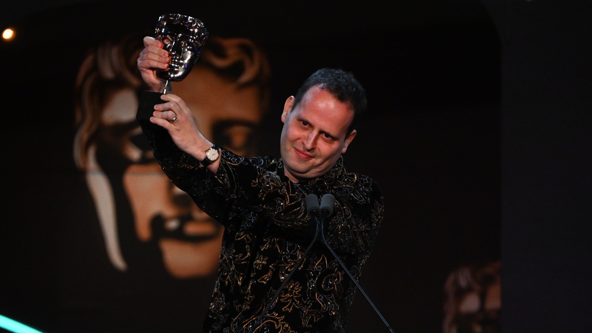 Adam Kay receiving a Bafta in 2023